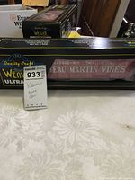 Front and side view of Weaver Ultra wine car display box with branding and wine label visible through clear window.
