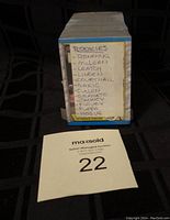 Photo of the side of the stacked cards showing a handwritten label noting rookie cards such as Ronning, McLean, and others.