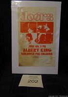 Full view of the vintage handbill featuring The Doors and Albert King concert date and venue.