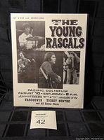 Front view of The Young Rascals concert poster with band photos and event details.