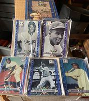 Collector's blue metallic tin featuring Jackie Robinson branding with vintage design and some rust marks on sides.