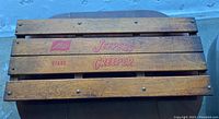 Top view of wooden planks with red lettering 'Jeepers Creepers' and number 97492, showing vintage wood grain and finish.
