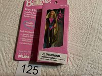 Front view of the 1995 Barbie Ocean Friends Key Chain in original pink packaging, showing doll with black and pink wetsuit and blonde hair, clear window plastic on front with attached diving mask and snorkel accessories.