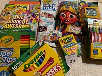 Photo of Crayola Epic Book of Awesome activity book with marker sets and crayons, paint, and bathtub crayons in original packaging.