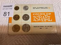 Front view of the 1966 Israeli proof coin set packaging with six coins displayed