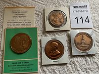 Mayor John V. Lindsay Franklin bronze proof medal in mint packaging with descriptive card, three additional bronze medals with visible details and patina.