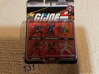 GIJOE Nano Metalfigs set in blister pack with Snake Eyes, Cobra Commander, Duke on top row and Baroness, Destro, Storm Shadow on bottom row.
