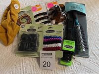 Comprehensive photo showing all items including headband, elastics, claws, clips, and brushes.