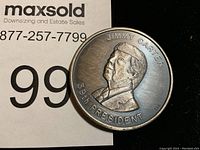 Close-up image of the Jimmy Carter medal showing detailed profile and inscriptions.