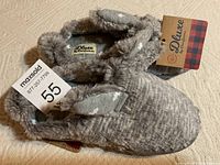 Pair of new grey girls bunny slippers with memory foam, showing bunny ears, pompom tails and Deluxe by Dearfoams tags.