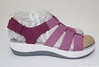 Side view of left sandal in deep fuchsia color showing multi-strap design, cushioned sole and adjustable heel strap.