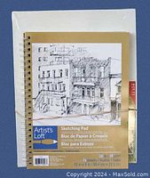 Two new art supplies: spiral-bound sketching pad and wrapped canvas panels.