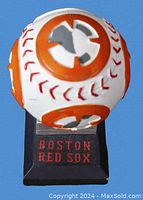 Front view of Base Ball-8 baseball statue showing orange and white panels with Star Wars BB-8 design, mounted on black base with red Boston Red Sox text.