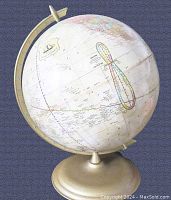 Side view of vintage 1960's world globe showing Pacific Ocean and some countries' boundaries.