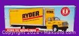 Front side view of the Ryder toy moving truck in box with clear branding and truck image.