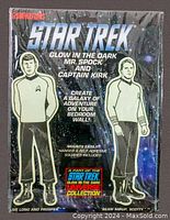 Full front view of sealed vintage packaging showing Mr. Spock and Captain Kirk glow in the dark figures on a space backdrop with text details.
