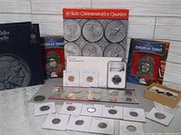 Overall view of coin lot showing folders, boxes, flips and loose coins