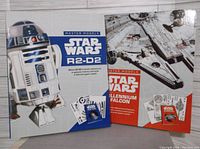 Front covers of the Star Wars R2-D2 and Millennium Falcon master model kits, showing box artwork and titles.