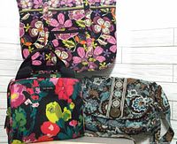Three Vera Bradley items: a lunch sak with colorful floral print and two handbags with blue and brown floral paisley prints