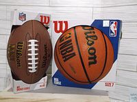 Photo of Wilson NFL Bronze Series Pee Wee football and Wilson NBA Forge size 7 basketball in original packaging.