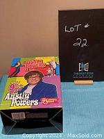 Box front showing colorful Austin Powers packaging with character image and 9th edition mark.