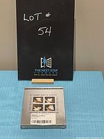 Front view of unopened DVD case for The Beatles 'A Hard Day's Night' Collector's Edition 2-disc set, showing metallic silver cover with four photos of band members.