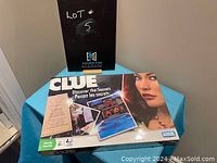 Front of unopened Clue board game box displaying artwork and branding