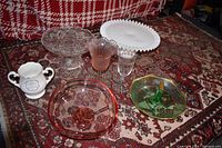 All glassware and collector's pitcher shown together on fabric background.