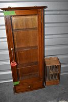 Full view of the vintage wood table shelf with glass door and attached tassel, alongside the wooden desk organizer with multiple compartments.
