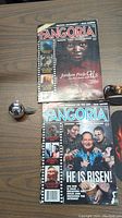 Two Fangoria magazines displayed on table along with a small Sentinel Sphere Christmas ornament.