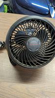 Front view of Honeywell black fan showing circular grille and blades.