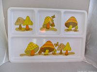 Vintage serving tray with four compartments featuring yellow and orange mushroom illustrations and small decorative butterflies on a white background.