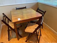 Assembled table with four chairs around