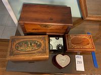Group image of five decorative boxes including wooden boxes, a velvet heart-shaped box, and an enamel box, showing general sizes and appearance.