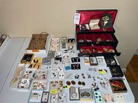 Full lot view showing jewelry box and laid-out jewelry pieces