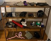 Full view of shelving unit filled with assorted travel and personal items