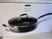 Photo of Epicure sauté pan in its packaging showing the pan and lid.
