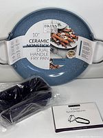 10-inch blue ceramic nonstick dual handle frying pan with packaging label showing brand Bklyn Steel and key features