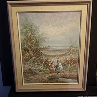 Full view of framed oil painting showing a rural scene with two figures walking along a path, vegetation, water in background, and sailboats on the horizon