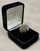 Ring in black velvet box showing inside lid with gold text 'Karat Gold Made in Italy'.