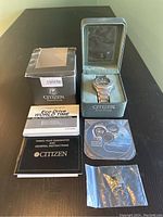 Citizen Eco-Drive Skyhawk titanium wristwatch in original box with manuals, warranty, software CD and extra link.