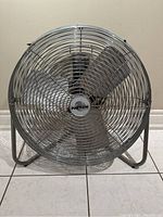 Front view of the metal Patton industrial floor fan with protective grill and four blades.