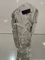 Angled side view showing shape and leaf motif with foil label