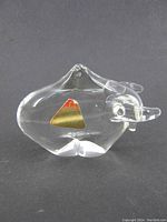 Clear Murano crystal glass bull figurine showing side profile with gold foil label.
