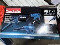 Closed box showing Makita branding and UB1103 model designation with blower image and specs.