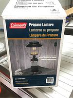 Front and side view of the original packaging box showing the Coleman propane lantern and model number 5151C