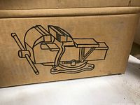 Box with line drawing of the vise showing the swivel base and operation handle.
