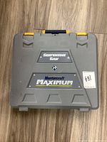 Closed gray hard plastic case labeled 'Serpentine Saw' and 'Mastercraft Maximum'