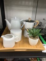 Photo showing all items on the bamboo tray: ceramic teapot, espresso maker, sugar bowl, creamer, faux plant