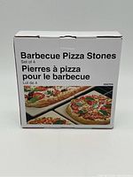 Box front showing "Barbecue Pizza Stones Set of 4" with images of cooked pizzas on stones.
